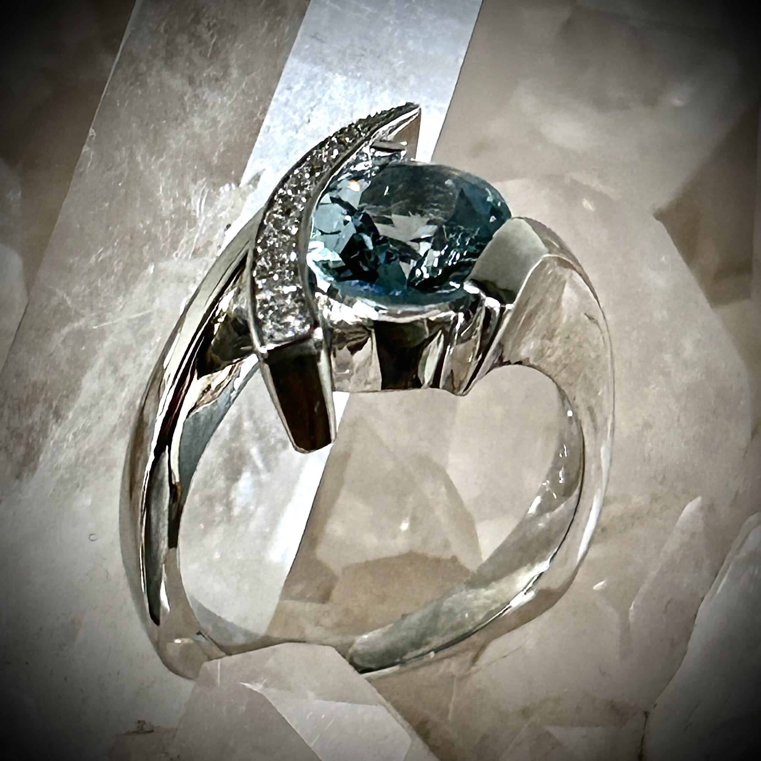 Explore This Elegant Aquamarine Diamond Ring Featuring A 1.96 Carat Oval Aquamarine, 14K White Gold And Natural Mined Diamonds.