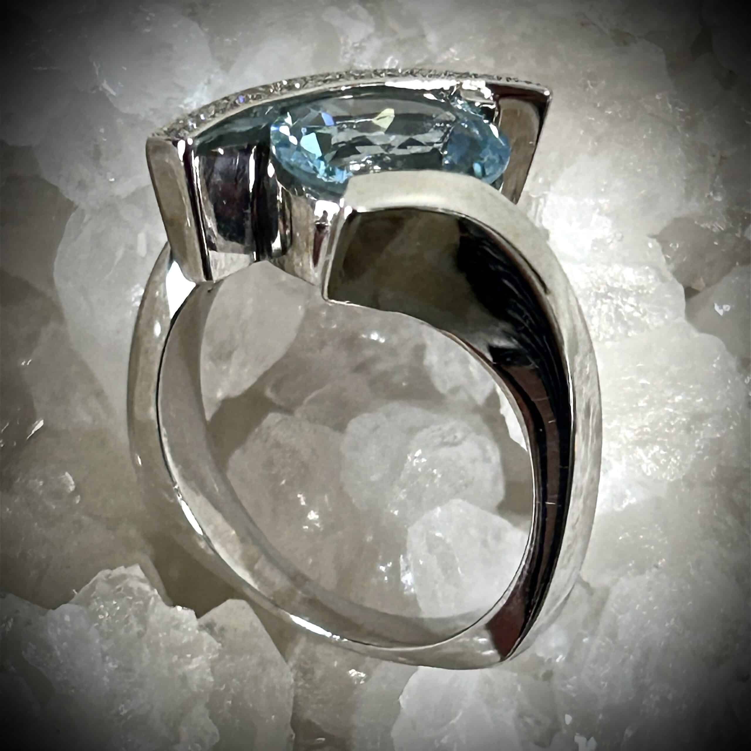 Explore This Elegant Aquamarine Diamond Ring Featuring A 1.96 Carat Oval Aquamarine, 14K White Gold And Natural Mined Diamonds.