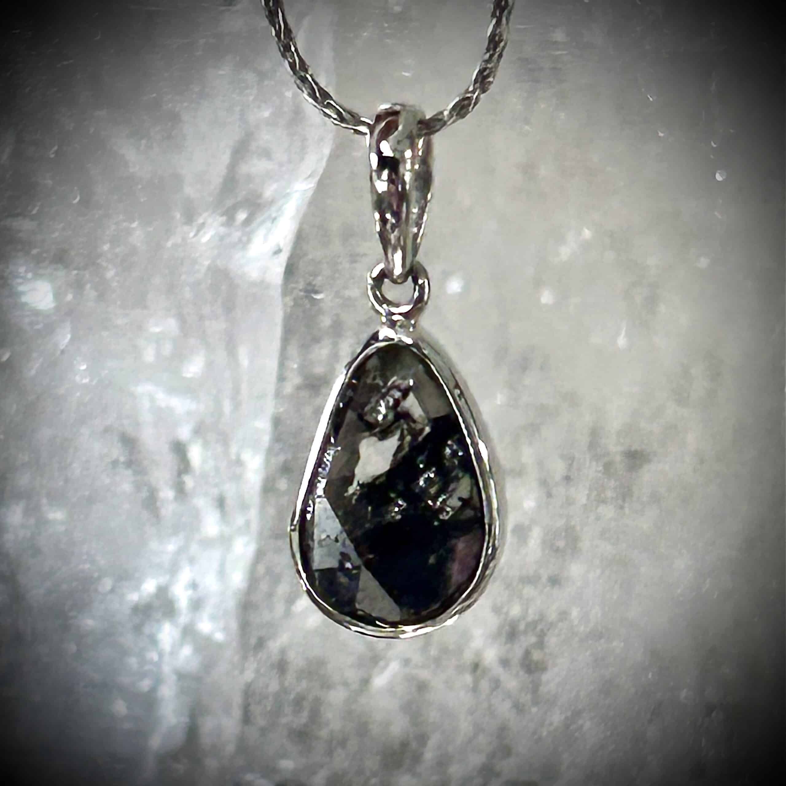 Freeform Diamond Slice Pendant In White Gold On Neutral Background.