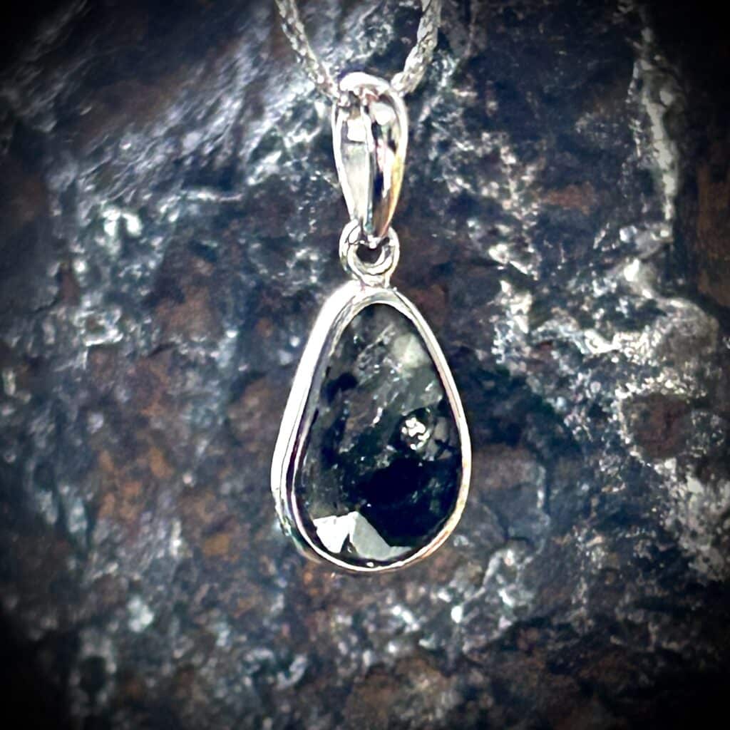 Freeform Natural Diamond Slice With Visible Inclusions.