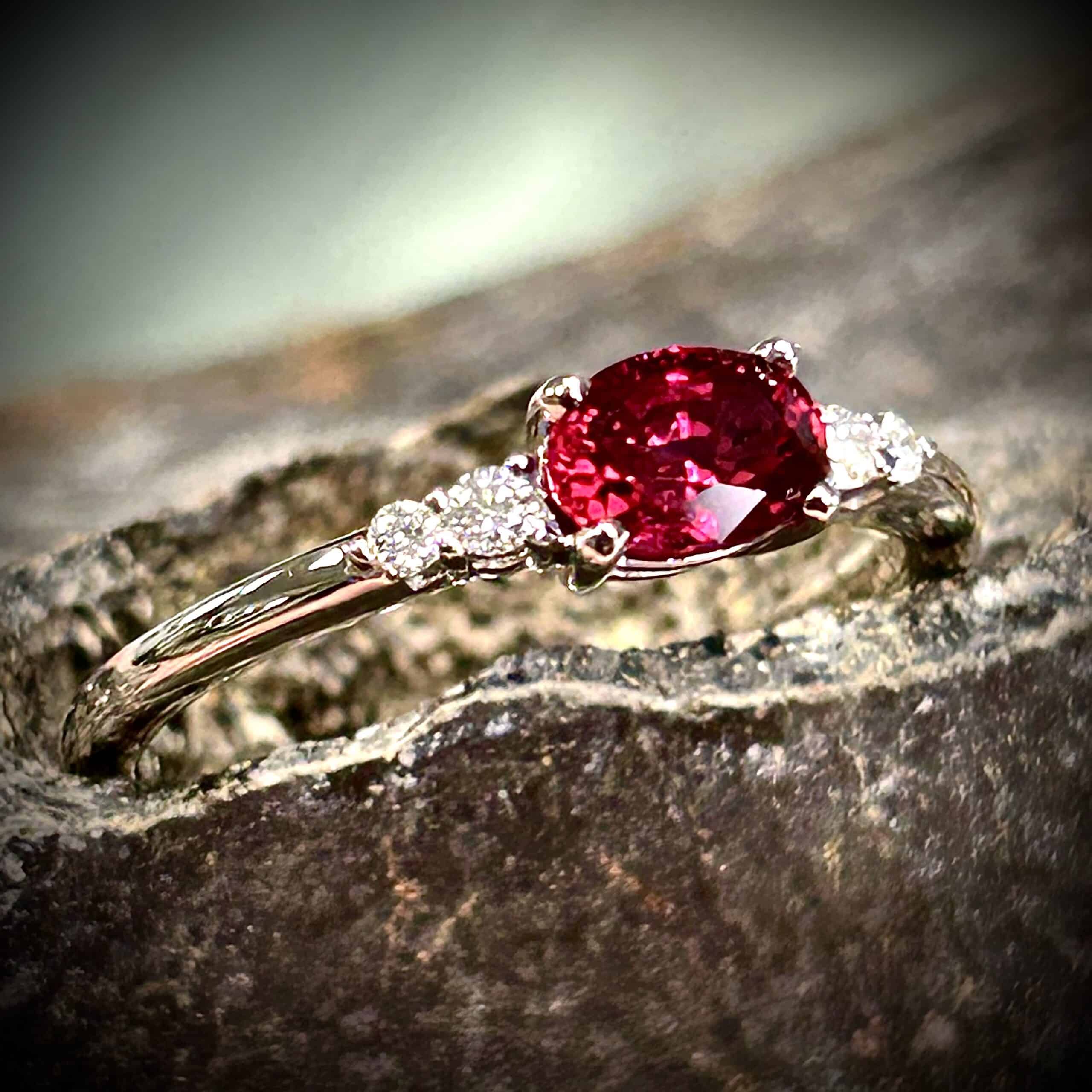 Exceptional .72 Carat Oval Natural Ruby Set In 14K White Gold With Diamond Accents.
