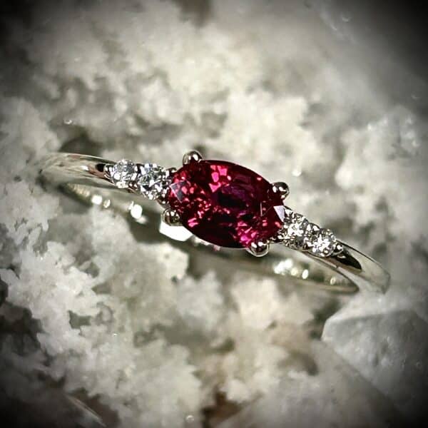 Close-Up Of A Deeply Saturated Natural Ruby Featured In A 14K White Gold Diamond Ring.