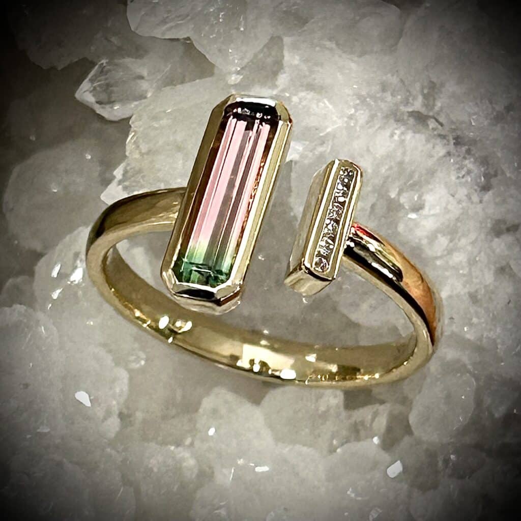 A Rare Watermelon Tourmaline With Diamonds Showcased In An Open-Ended Ring Design.